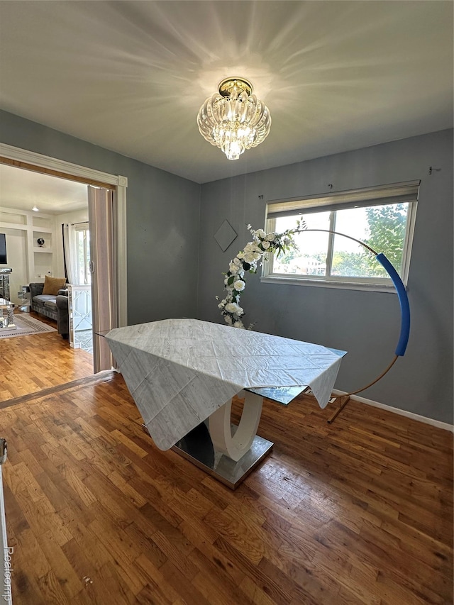 32302 Ryan Rd, Warren, MI 48092 - dining room featuring a chandelier and wood finished floors