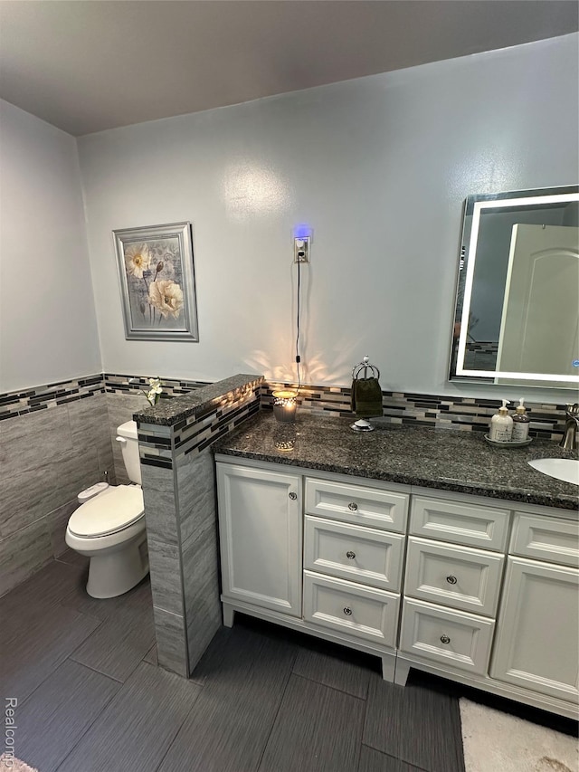 32302 Ryan Rd, Warren, MI 48092 - bathroom with tile walls, vanity, and a wainscoted wall