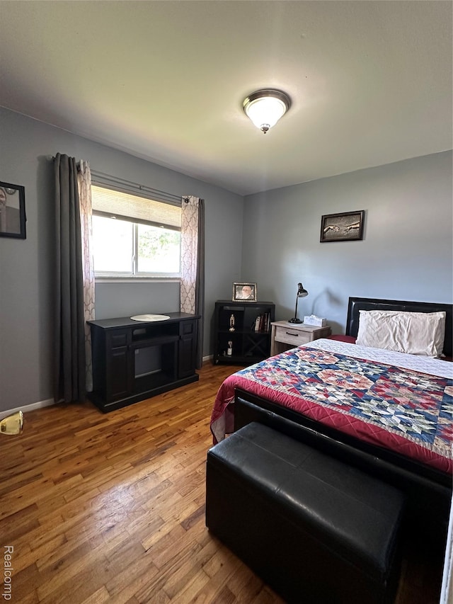 32302 Ryan Rd, Warren, MI 48092 - bedroom featuring wood finished floors and baseboards