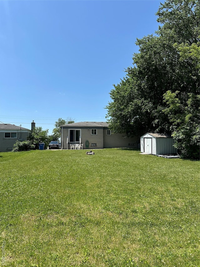 32302 Ryan Rd, Warren, MI 48092 - view of green lawn featuring a shed