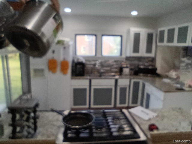 9360 Cheyenne St, Detroit, MI 48228 - kitchen featuring healthy amount of natural light, white cabinets, and recessed lighting