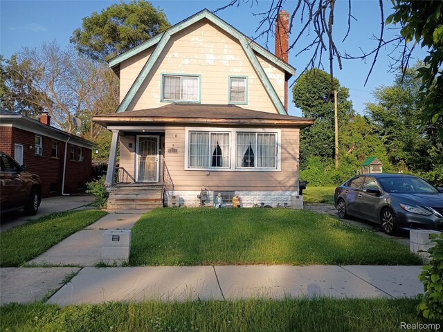 9360 Cheyenne St, Detroit, MI 48228 - colonial inspired home featuring a gambrel roof, a front lawn, and a chimney