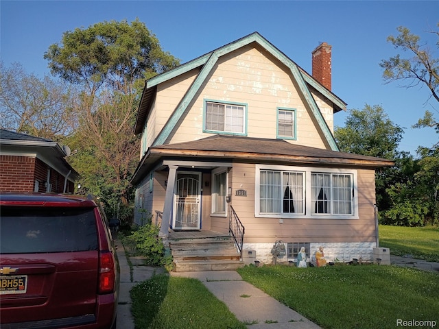 9360 Cheyenne St, Detroit, MI 48228 - dutch colonial with a gambrel roof, a front lawn, and a chimney