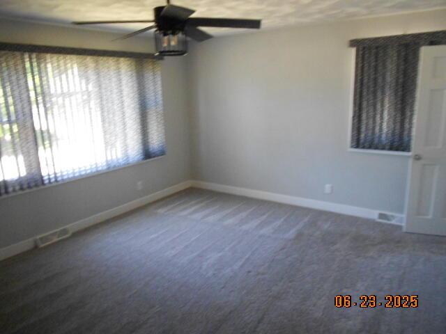 1090 Cadet Ln, Kalamazoo, MI 49009 - carpeted spare room featuring a ceiling fan and baseboards
