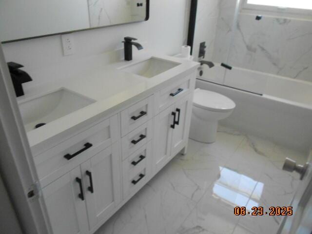 1090 Cadet Ln, Kalamazoo, MI 49009 - bathroom with marble finish flooring, double vanity, and shower / tub combination