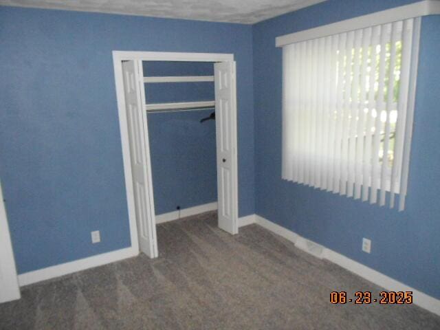 1090 Cadet Ln, Kalamazoo, MI 49009 - unfurnished bedroom featuring carpet and a closet