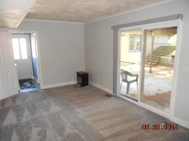 1090 Cadet Ln, Kalamazoo, MI 49009 - unfurnished living room featuring ornamental molding, a wood stove, and carpet