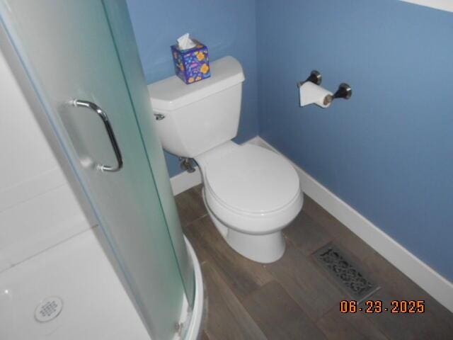 1090 Cadet Ln, Kalamazoo, MI 49009 - bathroom with a stall shower and wood finished floors
