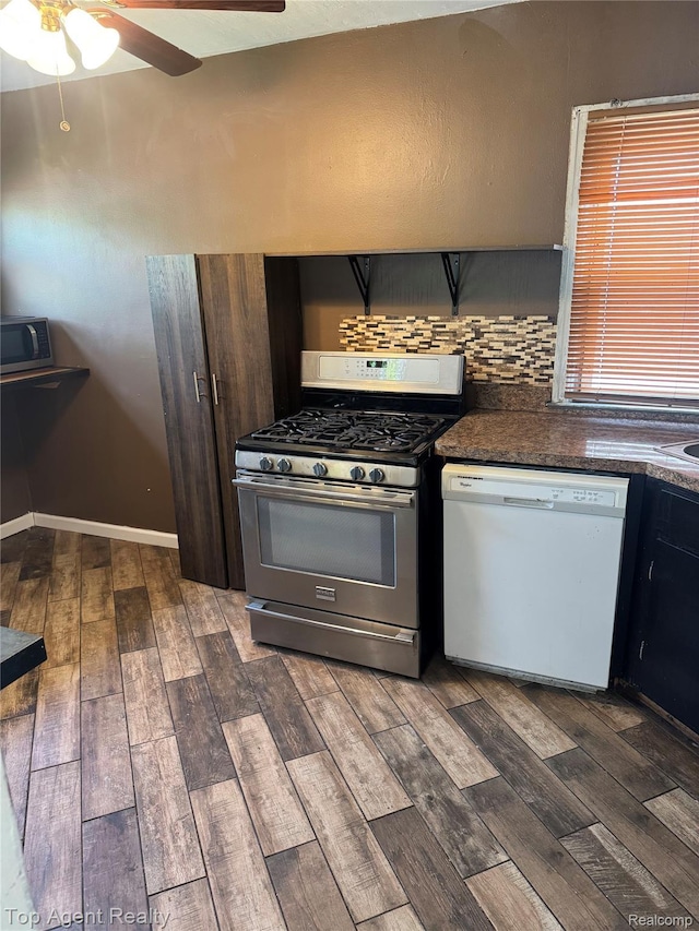 19461 Fenmore St, Redford, MI 48235 - kitchen featuring appliances with stainless steel finishes, dark wood-style floors, a ceiling fan, and dark countertops