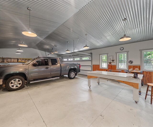928 Curtis Rd, Quincy, MI 49082 - garage featuring wooden walls and wainscoting