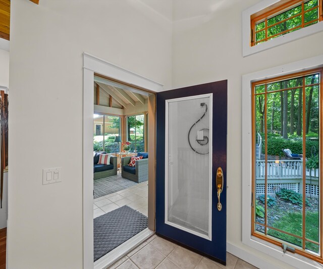 928 Curtis Rd, Quincy, MI 49082 - foyer entrance with light tile patterned flooring and high vaulted ceiling