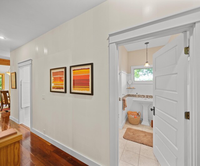 928 Curtis Rd, Quincy, MI 49082 - corridor with baseboards and light tile patterned floors