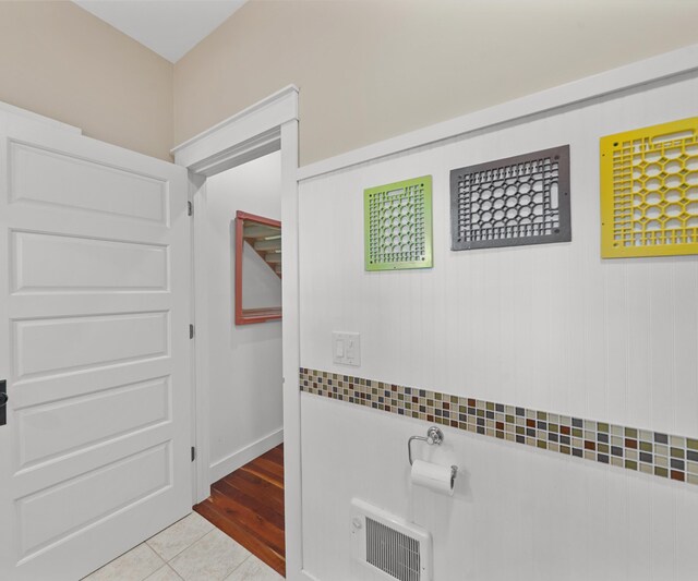 928 Curtis Rd, Quincy, MI 49082 - hallway with tile patterned flooring and heating unit