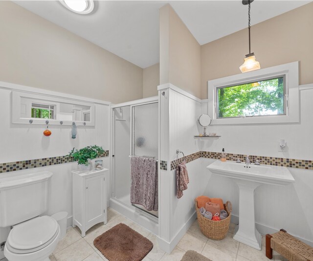 928 Curtis Rd, Quincy, MI 49082 - full bathroom featuring a stall shower, tile patterned floors, and a wainscoted wall