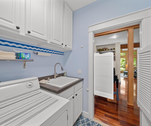 928 Curtis Rd, Quincy, MI 49082 - washroom featuring washer / dryer, cabinet space, and wood finished floors