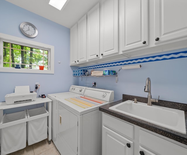 928 Curtis Rd, Quincy, MI 49082 - washroom with washer and dryer, cabinet space, and light tile patterned floors