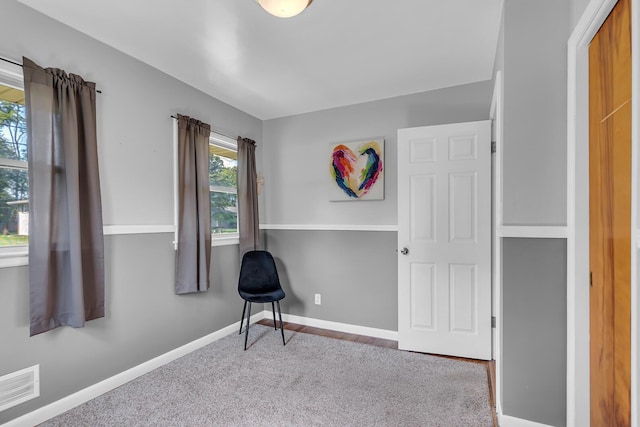 2606 S Saint Anthony St, Jackson, MI 49203 - living area featuring baseboards and carpet