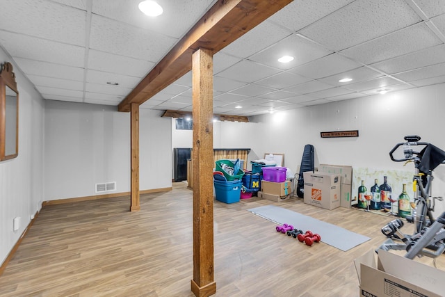 2606 S Saint Anthony St, Jackson, MI 49203 - exercise area featuring wood finished floors, a paneled ceiling, and recessed lighting