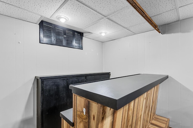 2606 S Saint Anthony St, Jackson, MI 49203 - indoor dry bar with a drop ceiling and a decorative wall