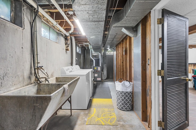 2606 S Saint Anthony St, Jackson, MI 49203 - basement featuring heating unit and washing machine and clothes dryer