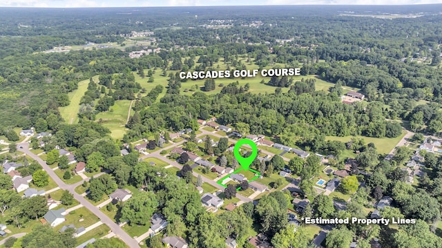 2606 S Saint Anthony St, Jackson, MI 49203 - aerial view of property and surrounding area featuring a heavily wooded area