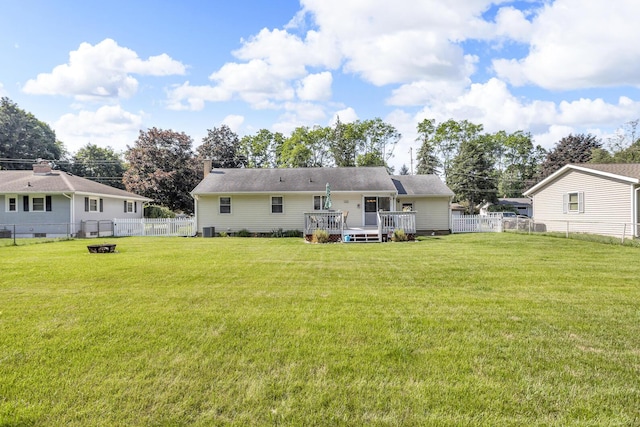 2606 S Saint Anthony St, Jackson, MI 49203 - back of house with a deck, a fenced backyard, and a chimney