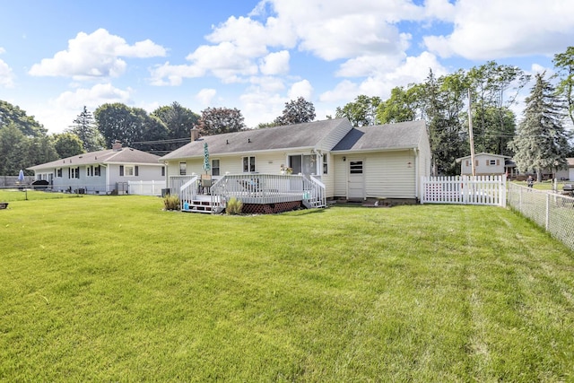 2606 S Saint Anthony St, Jackson, MI 49203 - rear view of property with a fenced backyard and a wooden deck