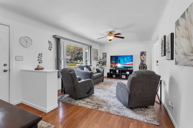 2606 S Saint Anthony St, Jackson, MI 49203 - living area featuring a ceiling fan and wood finished floors