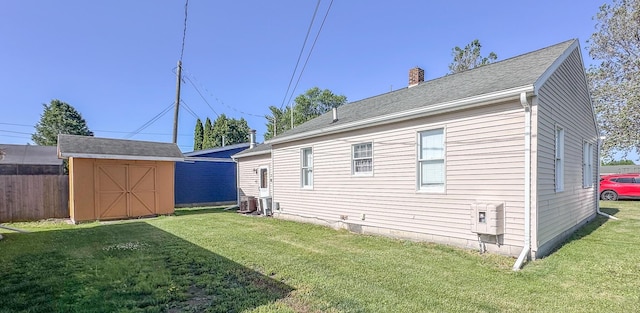 148 N Eddy St, Merrill, MI 48637 - back of property with a storage shed and a chimney