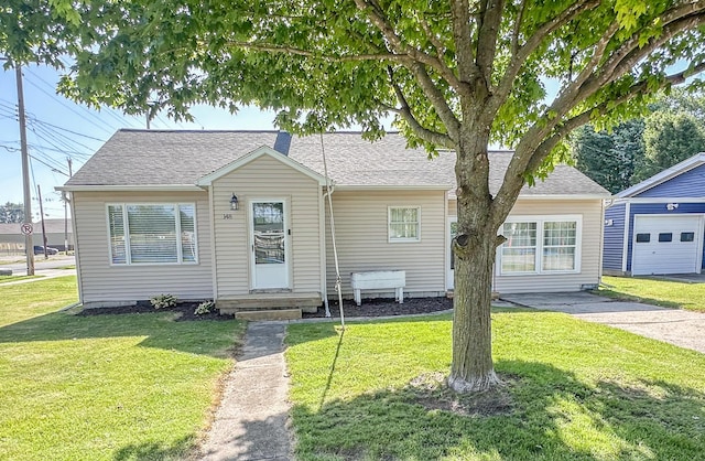 148 N Eddy St, Merrill, MI 48637 - bungalow-style house with a front lawn, entry steps, and roof with shingles