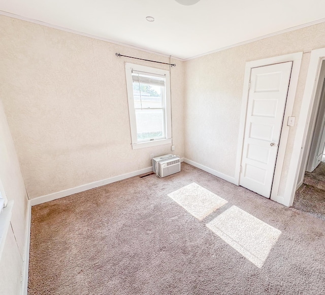 148 N Eddy St, Merrill, MI 48637 - empty room featuring carpet floors, ornamental molding, and a wall unit AC