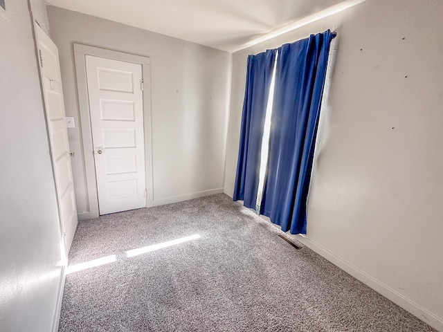 148 N Eddy St, Merrill, MI 48637 - carpeted spare room with baseboards