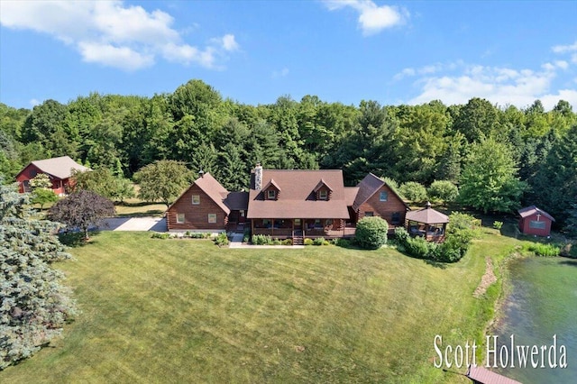 6311 142nd Ave, Holland, MI 49423 - aerial view of property and surrounding area featuring a heavily wooded area and a large body of water