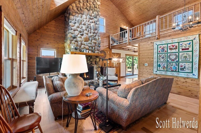 6311 142nd Ave, Holland, MI 49423 - living room featuring high vaulted ceiling, wood ceiling, wooden walls, a chandelier, and hardwood / wood-style floors
