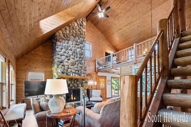 6311 142nd Ave, Holland, MI 49423 - living room featuring a wood ceiling with exposed beams, high vaulted ceiling, healthy amount of natural light, ceiling fan, and stairway