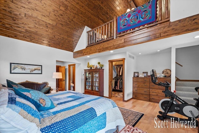 6311 142nd Ave, Holland, MI 49423 - bedroom featuring wooden ceiling, high vaulted ceiling, a walk in closet, wood finished floors, and recessed lighting