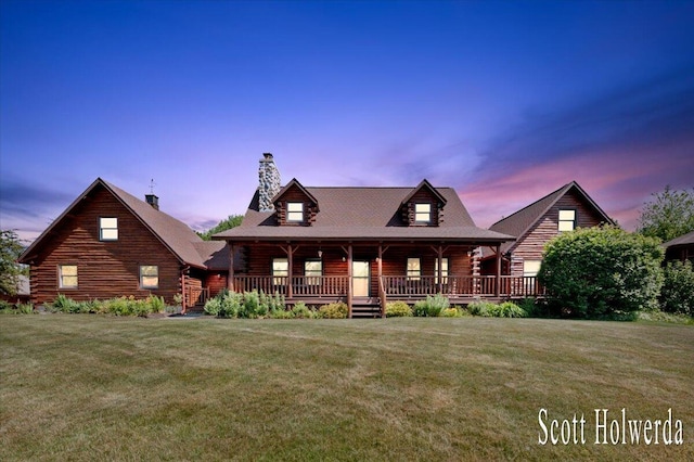 6311 142nd Ave, Holland, MI 49423 - log cabin with log exterior, a chimney, a yard, and covered porch