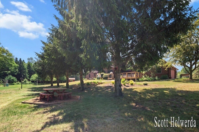 6311 142nd Ave, Holland, MI 49423 - view of green lawn featuring a deck
