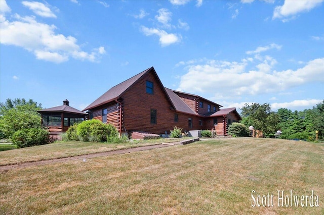 6311 142nd Ave, Holland, MI 49423 - view of side of home with a lawn and a gazebo