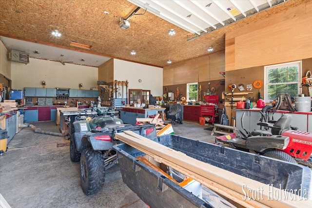 6311 142nd Ave, Holland, MI 49423 - garage featuring a workshop area, a garage door opener, and recessed lighting