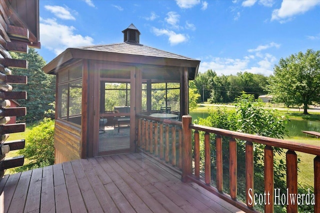 6311 142nd Ave, Holland, MI 49423 - wooden deck featuring a sunroom