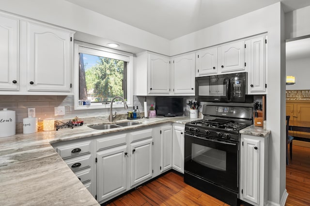7154 Sandpiper St, Portage, MI 49024 - kitchen featuring black appliances, white cabinets, backsplash, and dark wood-type flooring