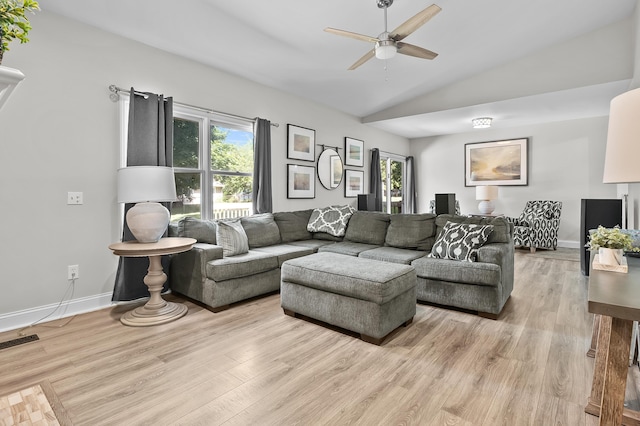 7154 Sandpiper St, Portage, MI 49024 - living room with vaulted ceiling, plenty of natural light, a ceiling fan, and light wood-style floors
