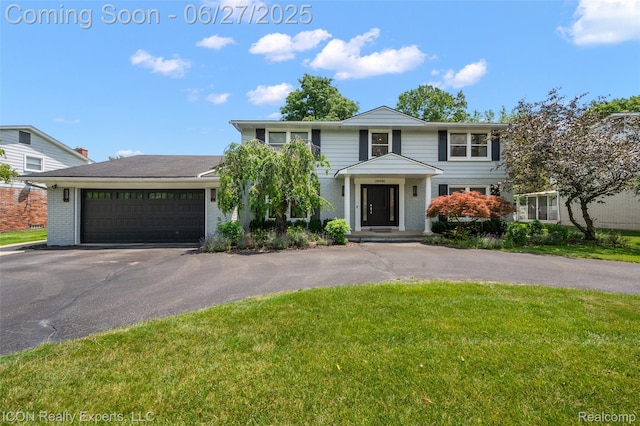 28440 Brooks Ln, Southfield, MI 48034 - traditional home featuring brick siding, driveway, and a front lawn