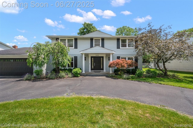 28440 Brooks Ln, Southfield, MI 48034 - view of front facade with brick siding and a front yard