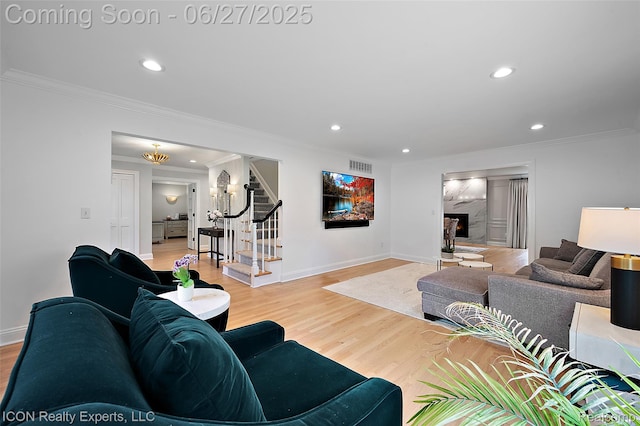 28440 Brooks Ln, Southfield, MI 48034 - living room with recessed lighting, stairs, wood finished floors, ornamental molding, and a premium fireplace