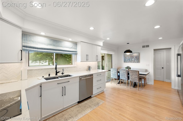 28440 Brooks Ln, Southfield, MI 48034 - kitchen featuring stainless steel dishwasher, ornamental molding, recessed lighting, backsplash, and light countertops