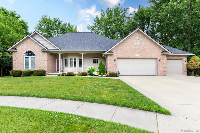 10267 Coachman Ct, Davison, MI 48423 - view of front facade with an attached garage, covered porch, brick siding, concrete driveway, and a front lawn