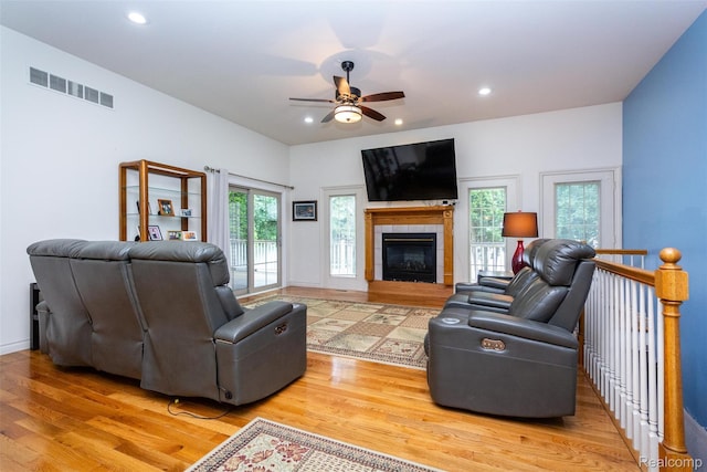 10267 Coachman Ct, Davison, MI 48423 - living room with wood finished floors, a ceiling fan, healthy amount of natural light, recessed lighting, and a tiled fireplace