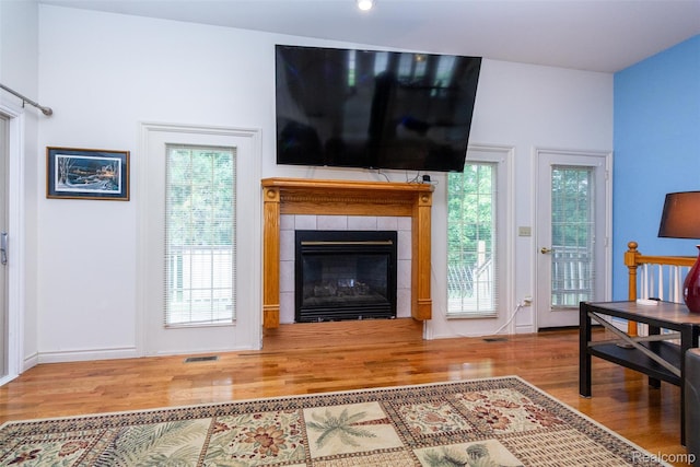 10267 Coachman Ct, Davison, MI 48423 - living room with wood finished floors and a tile fireplace